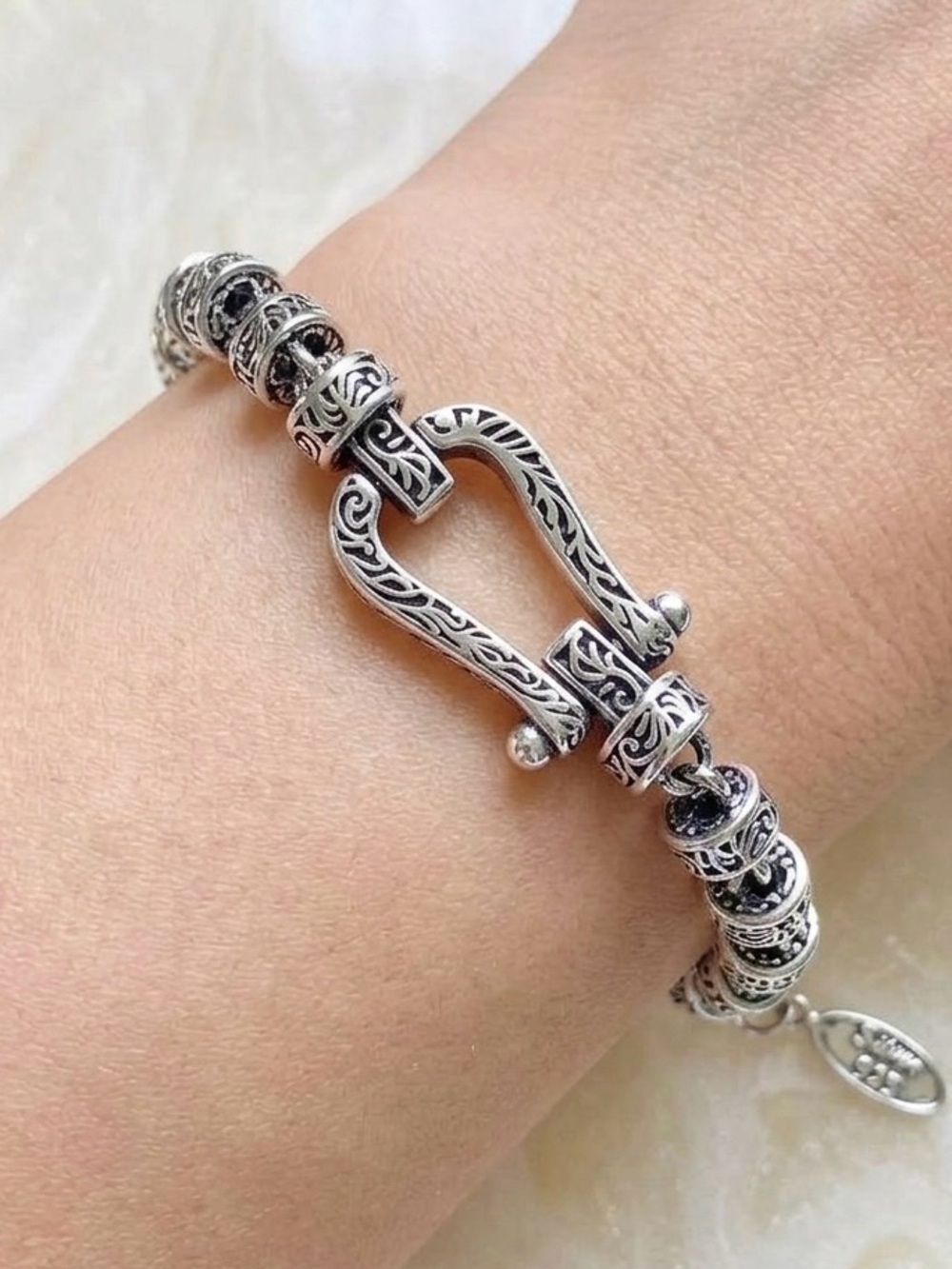 Intricate Silver-Tone Bracelet with Scrollwork Barrel Beads